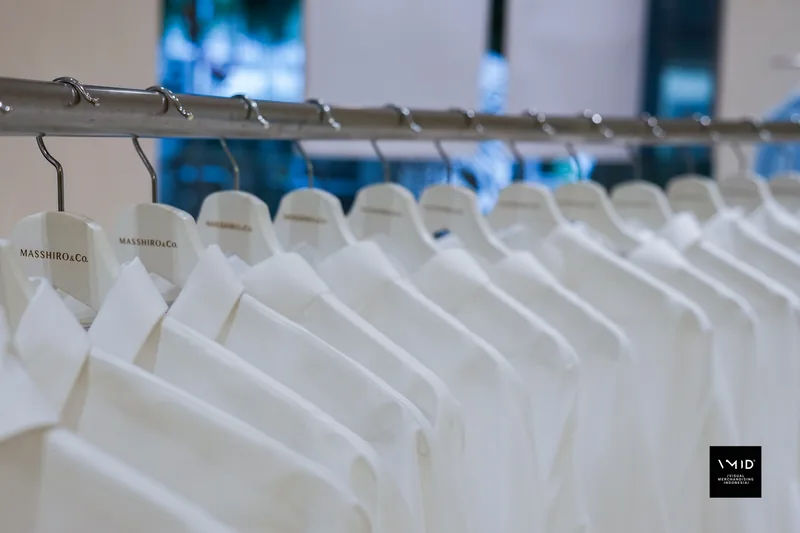 White shirts on hangers printed with the Masshiro&Co. name — 2022